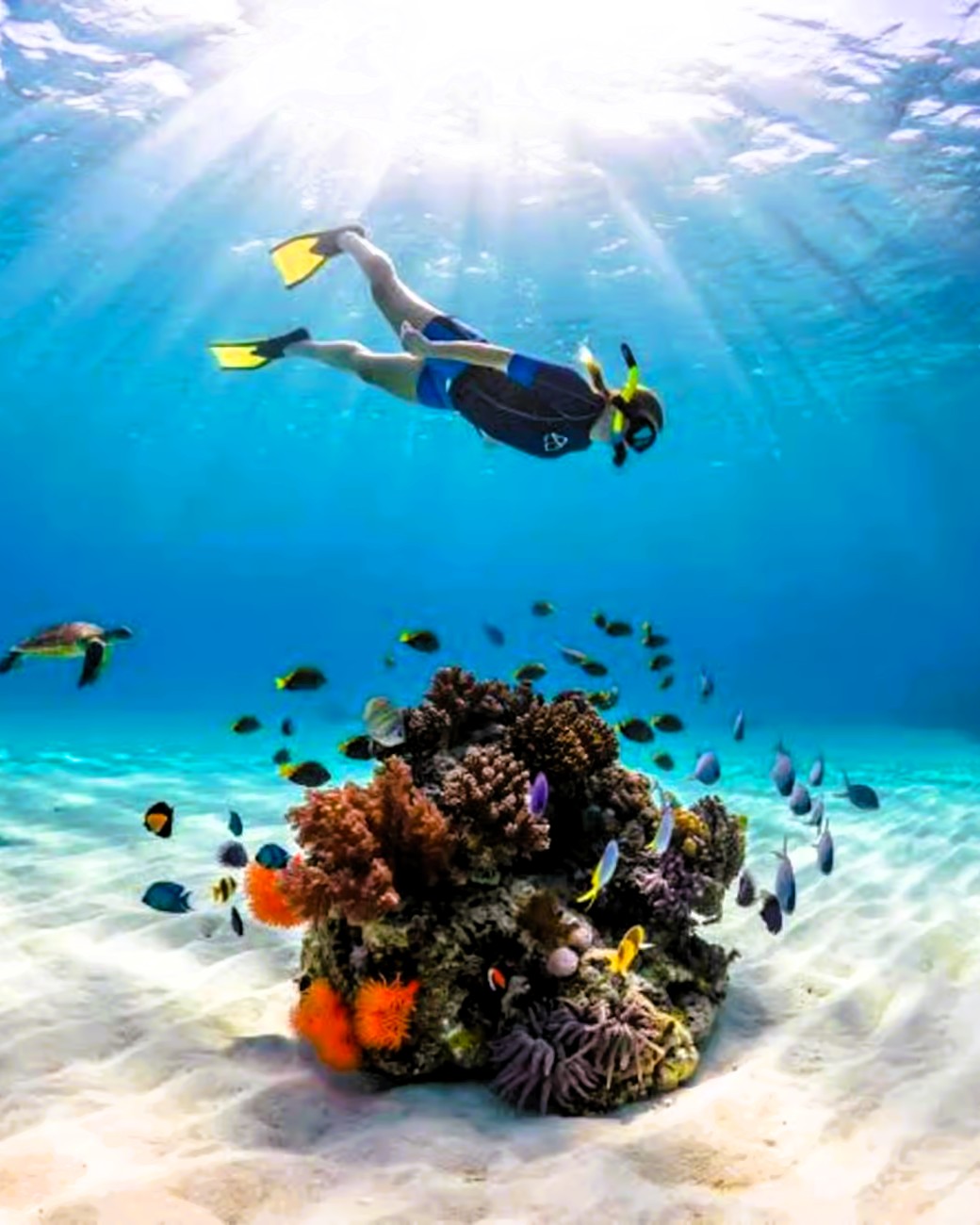 Blue lagoon crystal clear turquoise waters with sandbank and boat