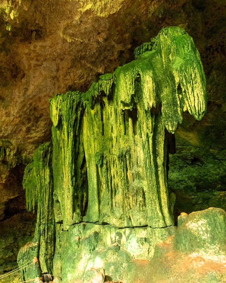 Swimming in Kuza Cave turquoise waters with natural rock formations